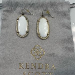 Kendra Scott white earrings.